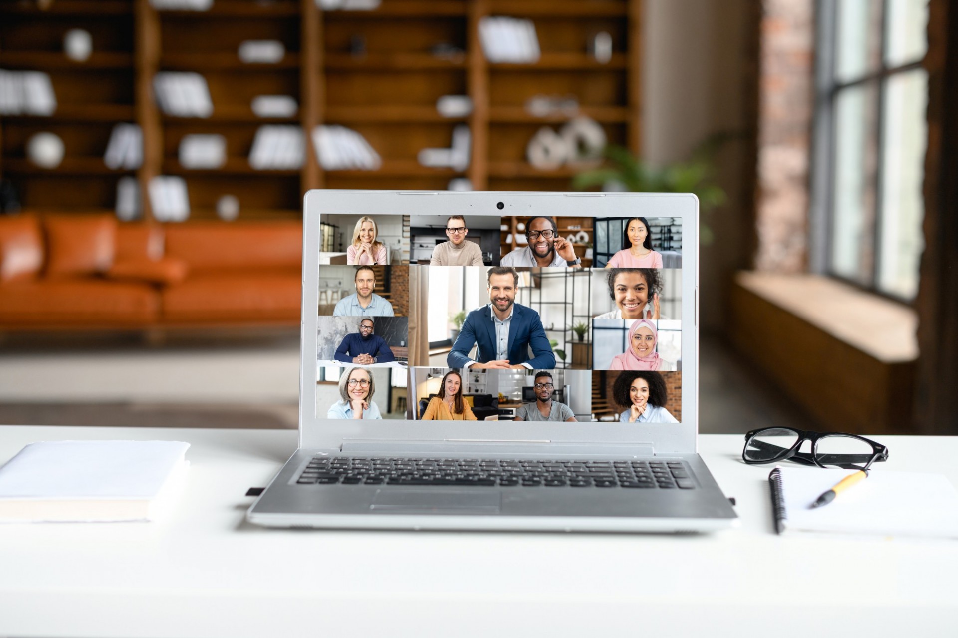 a laptop showing a digital meeting